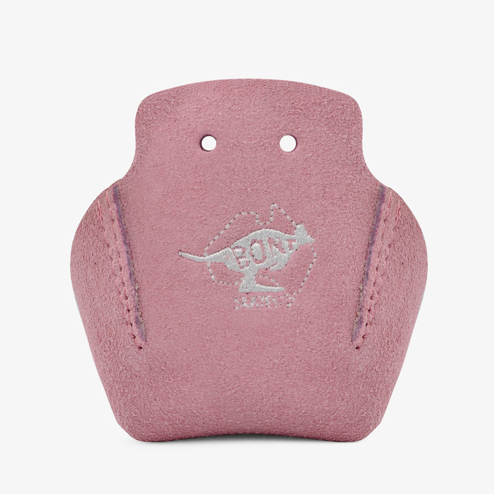 The pink suede leather guitar pick holder, akin to the robust Stitched Suede Toe Guards from Sunshine Rollers' Bont line, features two top holes and a stitched kangaroo logo with "ROO" on the front. Its durable leather promises longevity, while the elegant curved design and noticeable side stitching enhance its appeal.