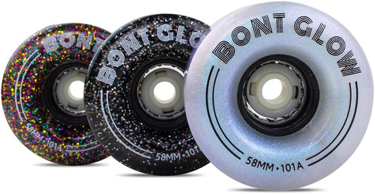 Three Glow Wheels by Sunshine Rollers, each radiating a vibrant neon glow, are aligned next to each other. These wheels showcase unique glitter patterns: one adorned with multicolored sparkles, another with black and white speckles, and the last with a pearly finish. Each wheel is labeled as 58MM - 101A from the Bont collection.