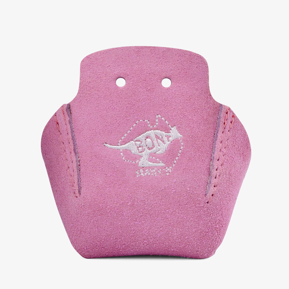 The Sunshine Rollers' Bont Stitched Suede Toe Guards, with their pink suede reminiscent of Roller Derby gear, showcase a kangaroo logo accompanied by the word "Boomerang." Crafted from durable leather and expertly stitched along the sides, they curve perfectly and include two small holes near the top for added ease and style.