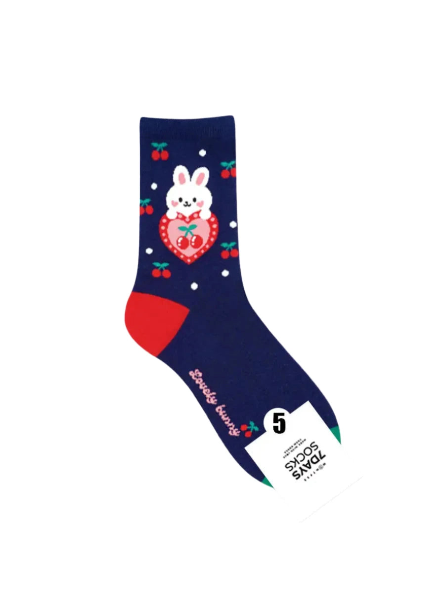 Navy blue sock with bunny design and red accents on a light gray background