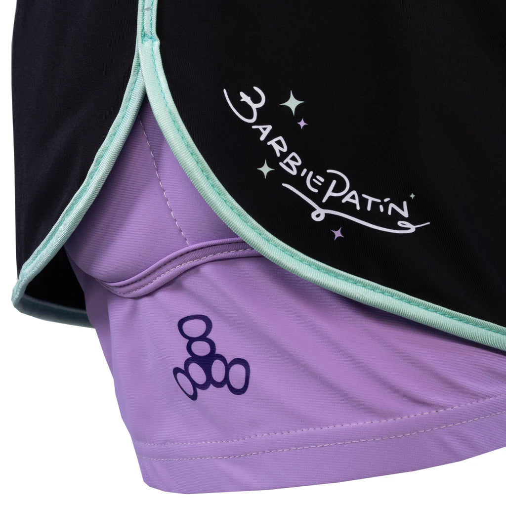 Close-up of a purple and black sports pad with 'Barbie Patin' branding.