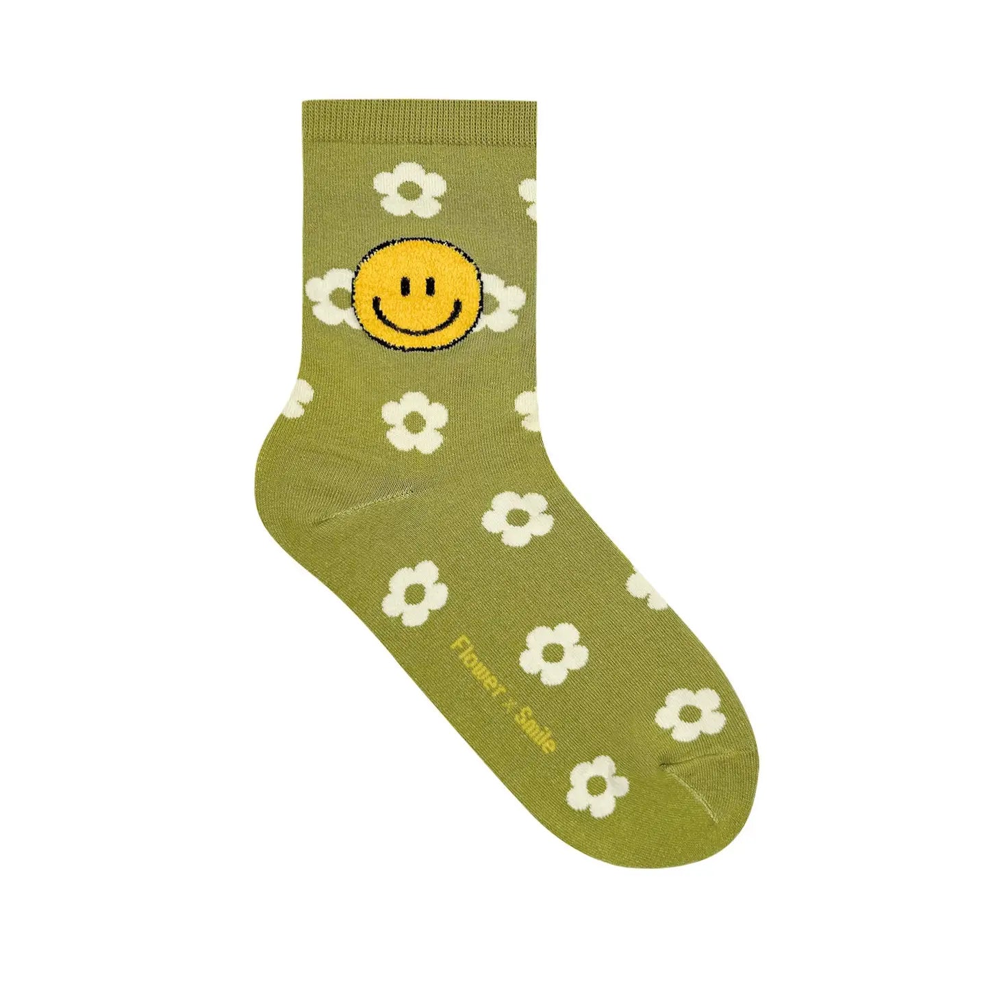 Green sock with smiley face and flower patterns on a white background