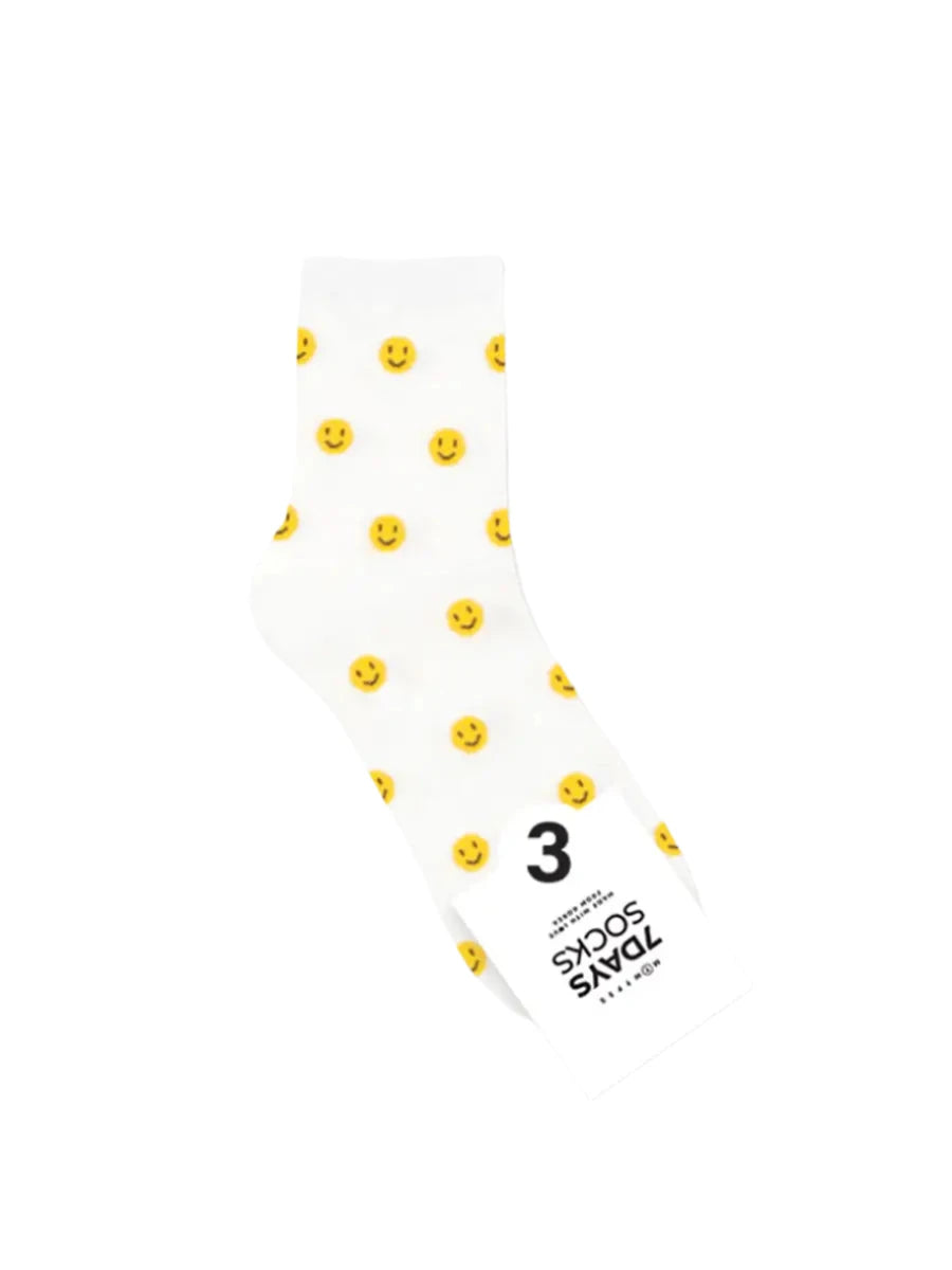 White socks with yellow floral patterns on a white background