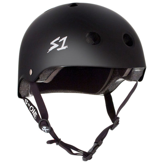 The S1 Lifer Helmet - Matte Black by Sunshine Rollers, featuring the white S1 logo on the side and designed with ventilation holes, is available at Sunshine Rollers Skate Shop. It comes with adjustable straps and a buckle for comfortable chin fastening.